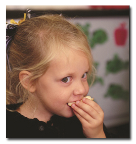 girl eating bread